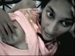 Lying On Her Bed Straight Haired Slim Indian Chick Tries To Show Her Tits
